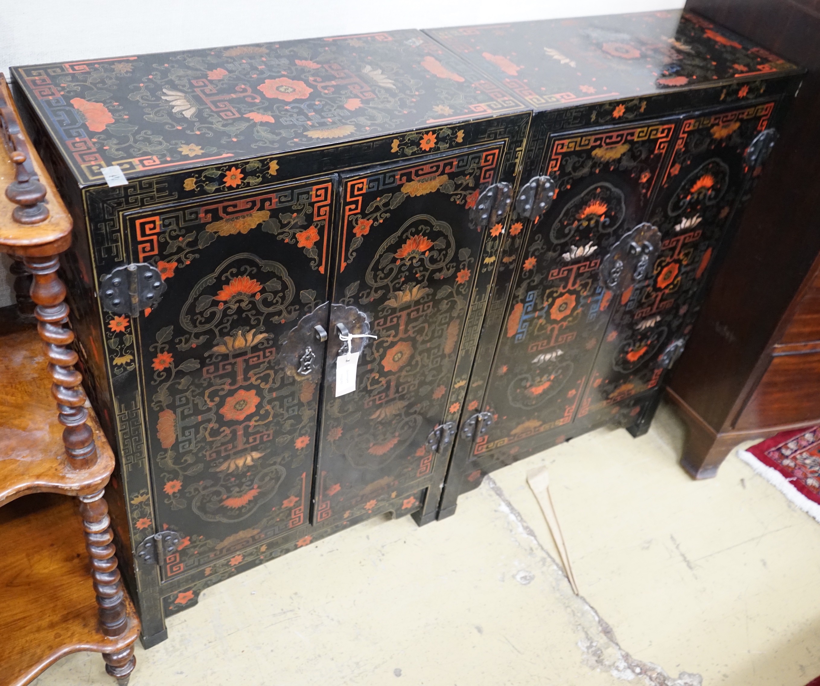 A pair of Chinese painted two door side cabinets, width 61cm, depth 31cm, height 93cm